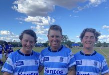 Father and son taking on the field together